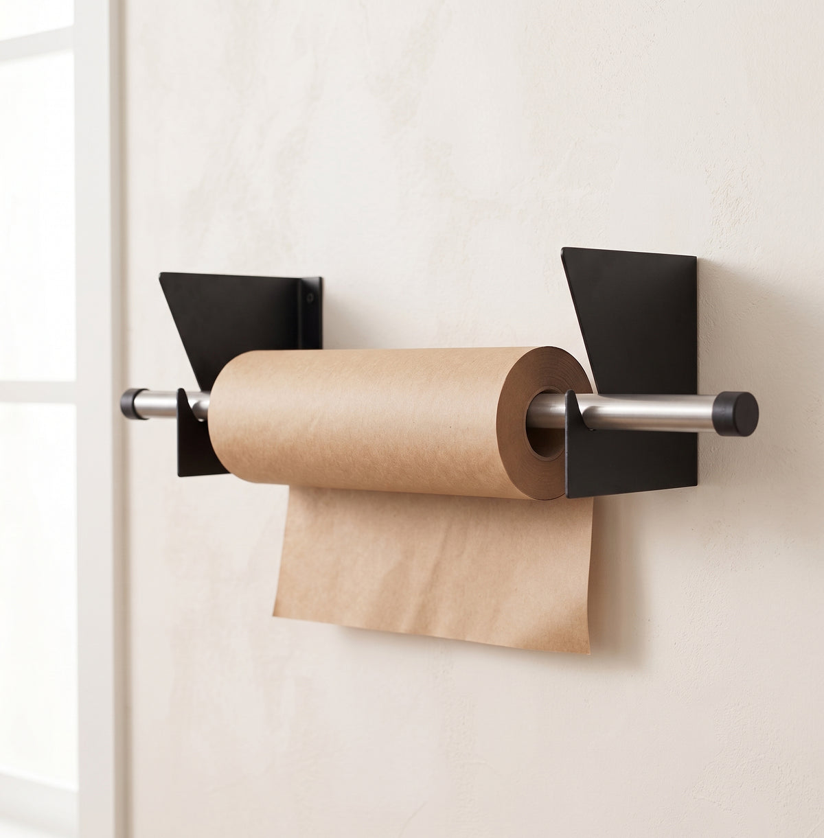 Roll holder mounted on wall with kraft paper roll loaded