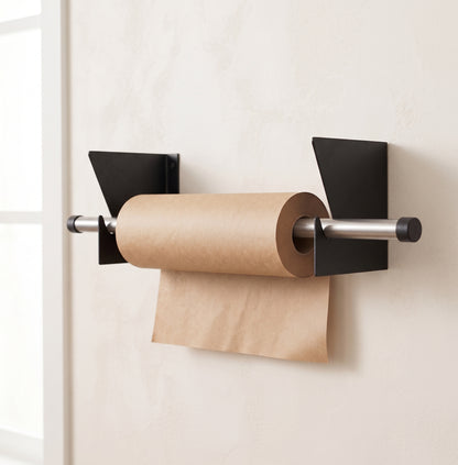 Roll holder mounted on wall with kraft paper roll loaded